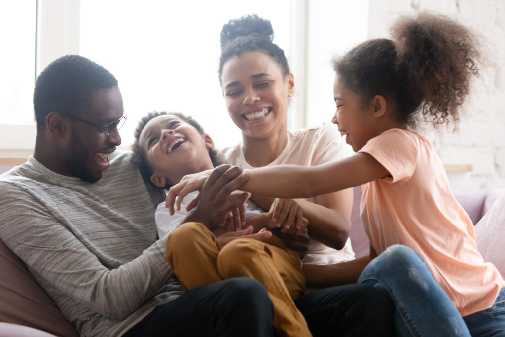 Two millennials and their young family. Learn more about insurance for millennials.
