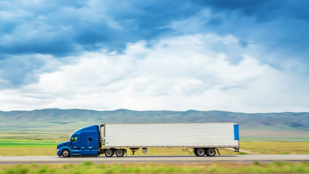 Big rig on its normal route to deliver its cargo while staying safe on the road.